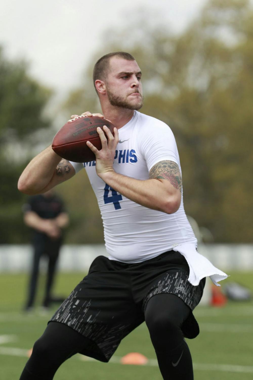 <p>Former Tiger quarterback Riley Ferguson gets ready to throw a pass. The NFL prospect worked out for scouts at the University of Memphis Pro Day on Tuesday.</p>