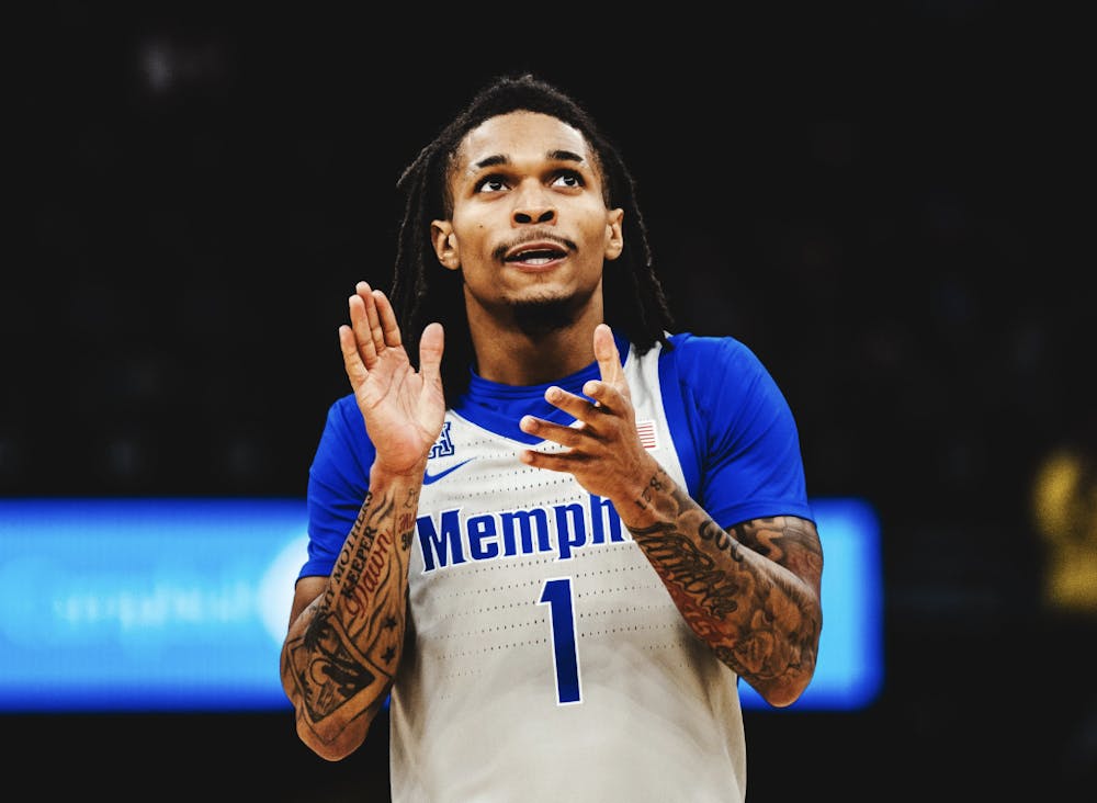 Memphis guard Dug McDaniel claps for his teammates in the Tigers' 86-70 victory over New Orleans at FedExForum Wednesday night. McDaniel finished with a double-double in points and assists in the effort.