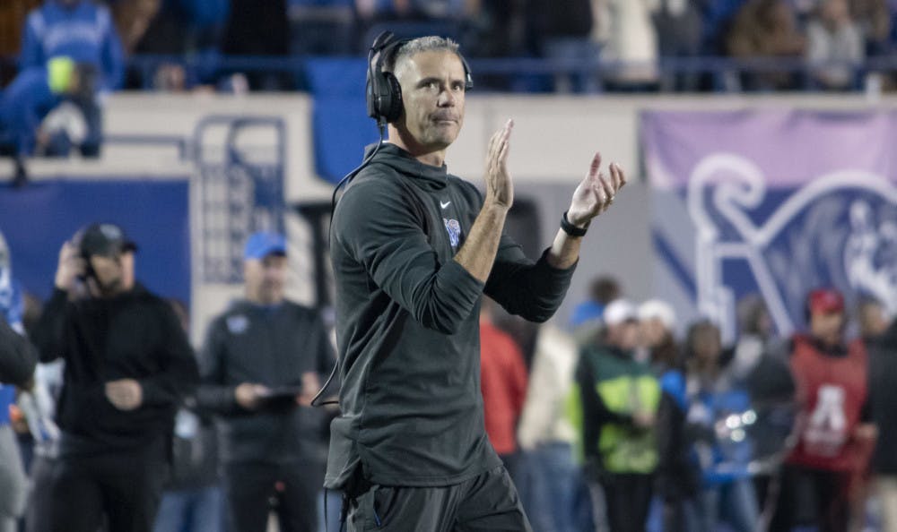 <p>Mike Norvell applauds his defense after a third down stop. The Memphis Tigers play the Cincinnati Bearcats Friday at the Liberty Bowl to end their regular season slate.&nbsp;</p>