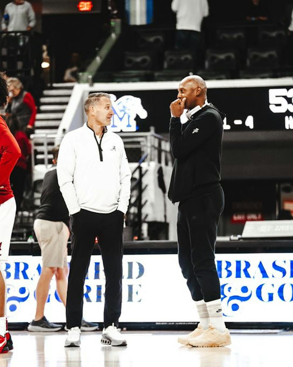 Memphis' Penny Hardaway and Alabama's Nate Oats talk before the Rocket City Classic.