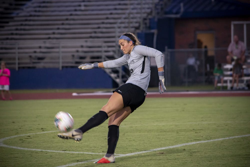<p>Elizabeth Moberg punts the ball away after collecting a save against North Texas. Moberg was named the AAC Goalkeeper of the Week the past two weeks with three consecutive shutouts.</p>