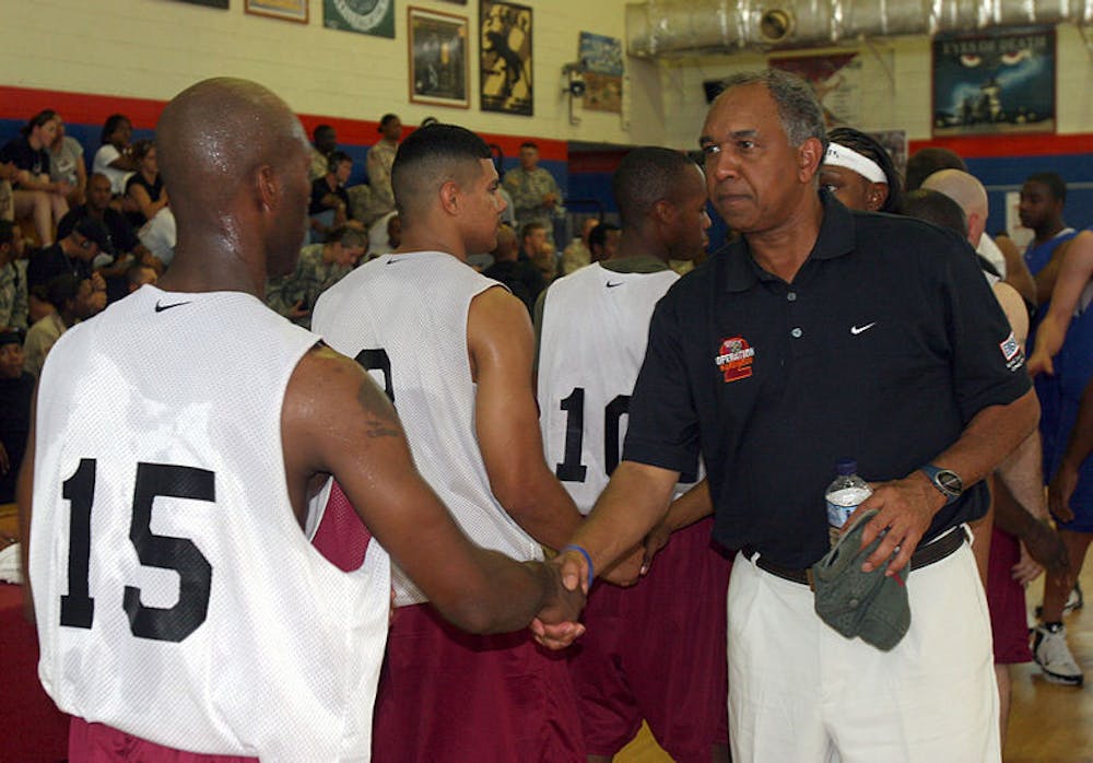 <p>Tubby Smith, then University of Kentucky coach, congratulates Camp Virginia players after a game during the Operation Hardwood basketball tournament in 2006. Smith was announced as the new University of Memphis men’s basketball coach Thursday.&nbsp;</p>