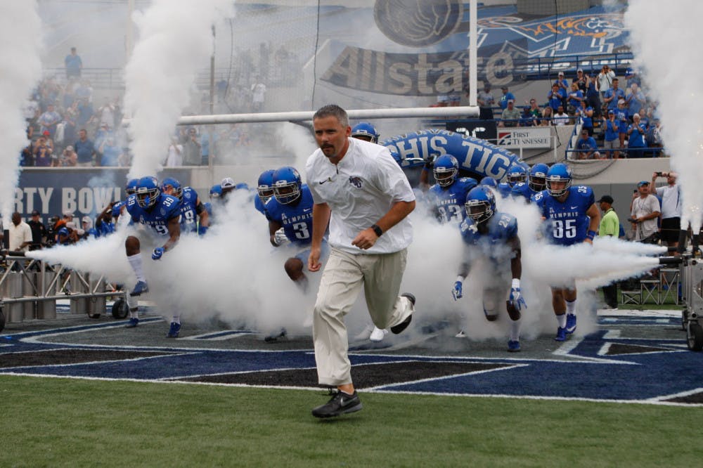 <p>Mike Norvell leads his Tigers onto the field prior to their game against</p>
<p>Kansas. Norvell helped the Tigers go 10-3 in the 2017-18 season.</p>
