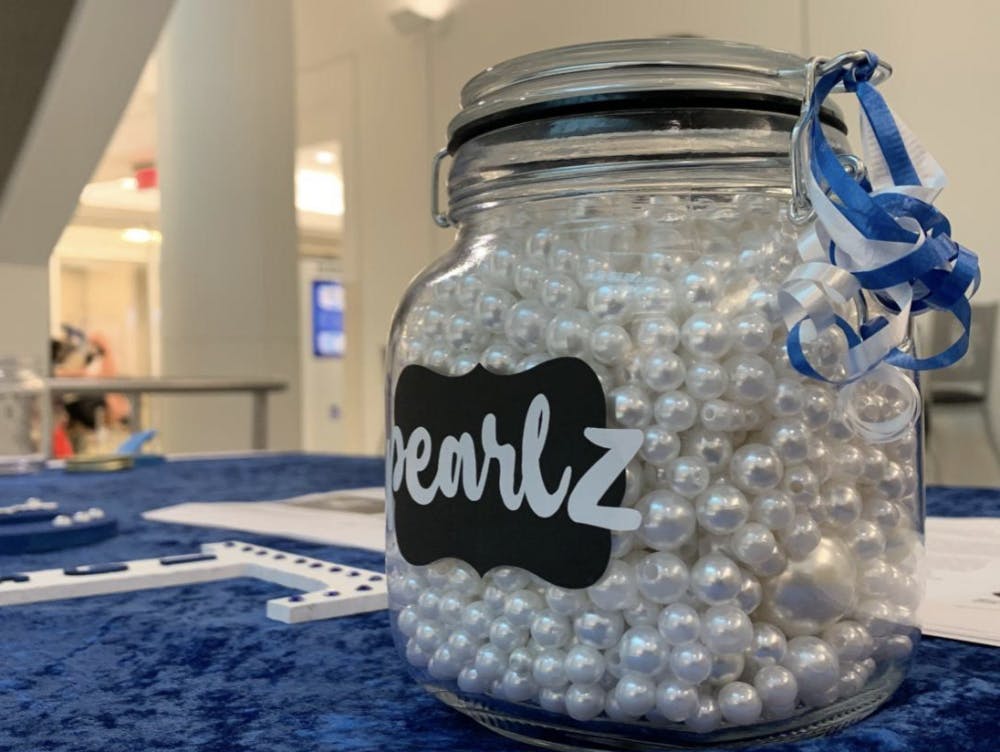 <p>Participants can guess the number of pearls inside the jar to win a prize from the Zeta sorority.</p>