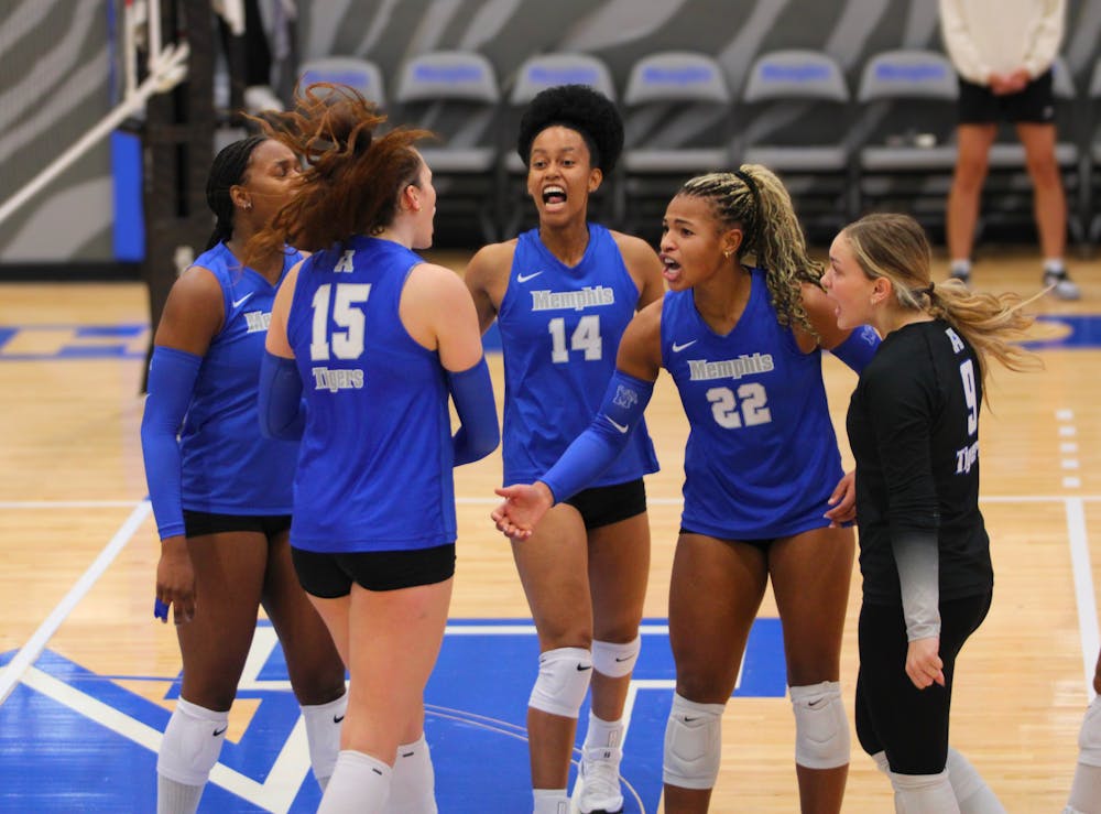 <p>The Memphis volleyball team celebrates a point in its come from behind win against USC Upstate on Friday at Elma Roane Fieldhouse.﻿</p>