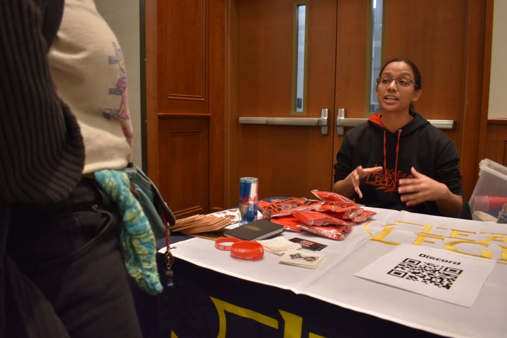 <p class="p1"><strong>Courtney Bynum sits at the eSports Gaming Association table at the Student Involvement fair on Jan 23. The group has more than 200 members.</strong></p>