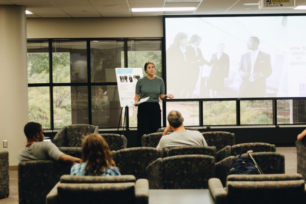 <p>Laura Wichman of Career Services instructs students on the how to properly dress for the career fair. Wichman also gave students tips on prepare for the career fair.</p>