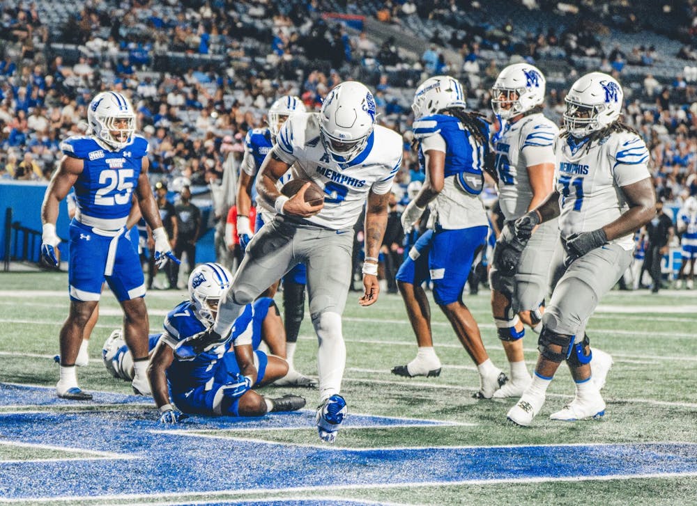 <p>Memphis quarterback Brendon Lewis runs into the end zone in the Tigers&#x27; 38-16 victory of Georgia State Saturday in Atlanta.</p>