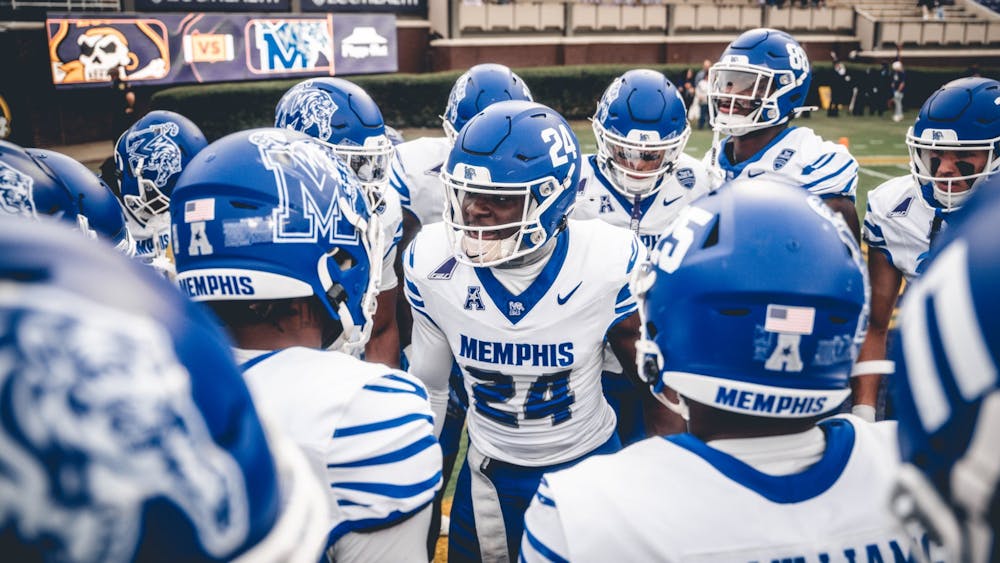A group of Tigers huddles up before Memphis' 31-27 defeat at East Carolina Saturday afternoon in Greenville, NC.