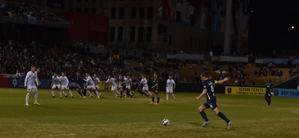<p>901 FC captain Marc Burch aims a free kick toward the Indy Eleven net. Memphis lost their home opener 4-2 and have not beaten Indy Eleven.&nbsp;</p>