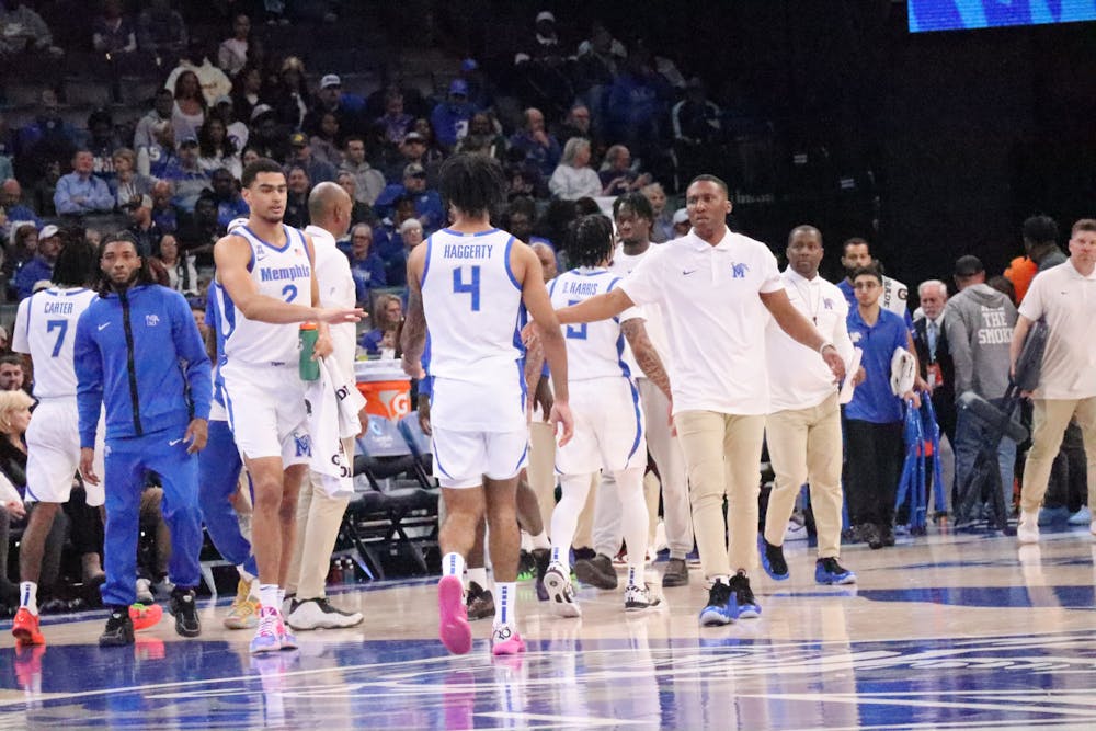 Memphis celebrates heading into a timeout.