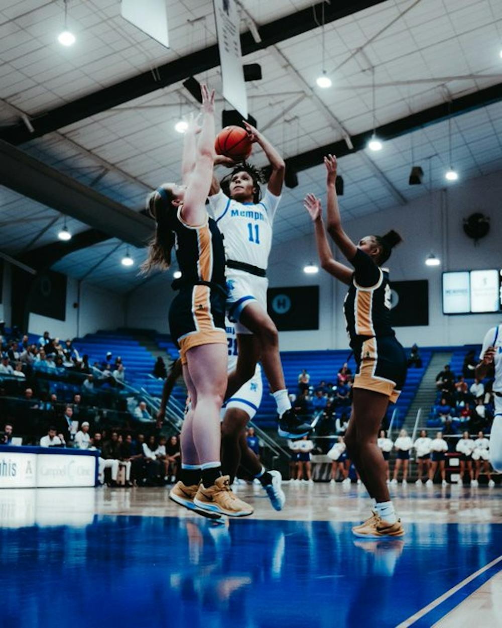 Memphis guard Tanyuel Welch shoots a contested jumper against Murray State.