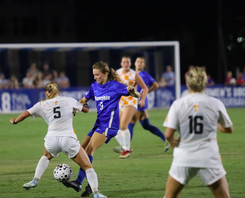 <p>Memphis forward Flavie Dubé attempts to dribble through two Tennessee defenders in the Tigers&#x27; 0-0 tie against the No. 2 ranked Volunteers on September 4 at home.﻿</p>