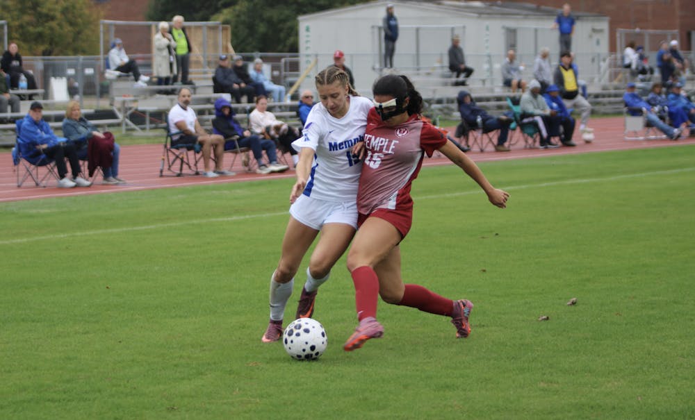 <p>Memphis winger Elise Perron battles for the ball with a Temple defender in the first half of Memphis&#x27; 6-0 victory Monday afternoon.</p>