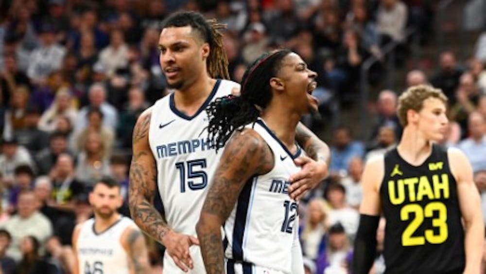 Ja Morant and Brandon Clarke celebrate after a Morant shot.