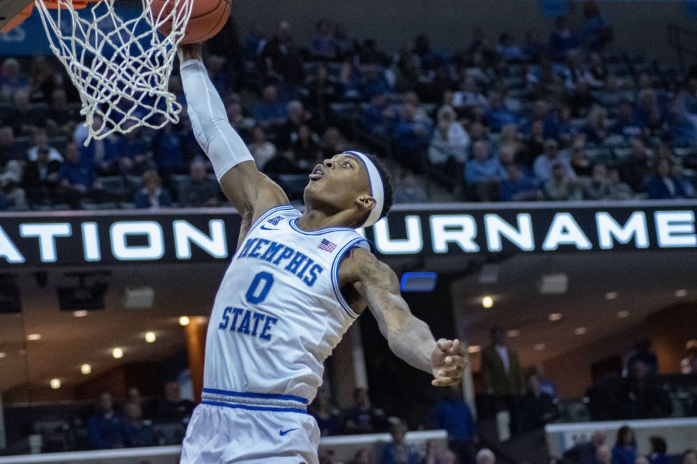 <p>Kyvon Davenport goes for the dunk in a fast break. Memphis defeated San Diego 74-60 in the first round of the NIT.</p>