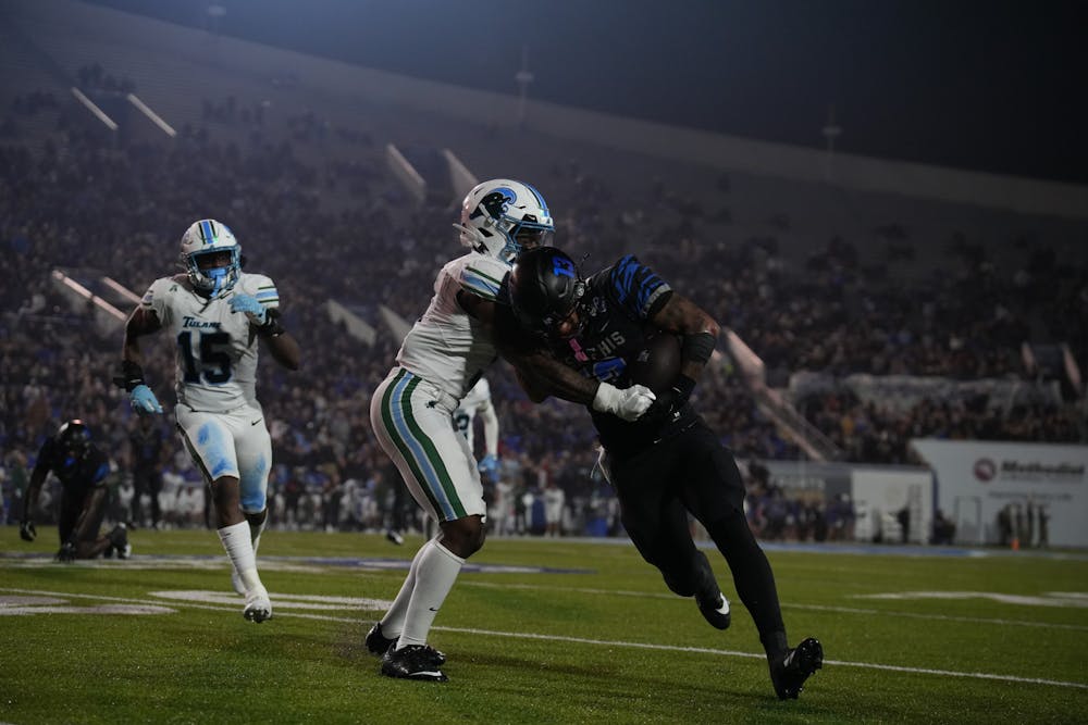 Memphis running back Greg Desrosiers Jr. runs by a Tulane defender in the Tigers' 38-32 loss Friday night at Simmons Bank Liberty Stadium.
