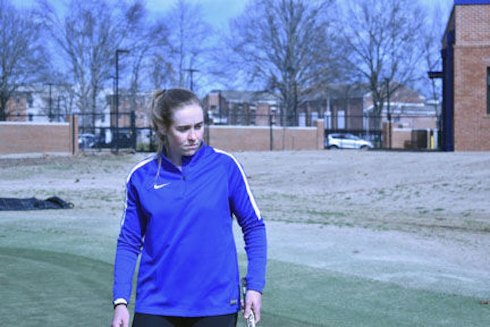 <p>Redshirt Senior Michaela Fletcher looks at her ball rolling on the green. Fletcher was the first player in Memphis history to advance to the NCAA Finals in 2015.</p>