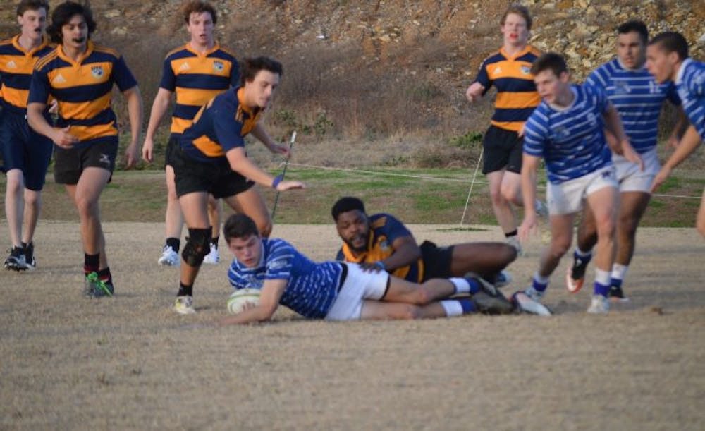 <p class="p1"><span class="s1"><strong>Turk Wigley secures the ball after he was tackled by a UTC defender. Wigley started his first year on the Tiger Rugby team after being recruited in 2018.</strong></span></p>