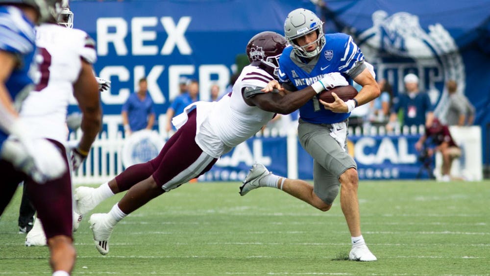 <p>Seth Henigan rushes during Memphis' 31-29 win against Mississippi State.</p>