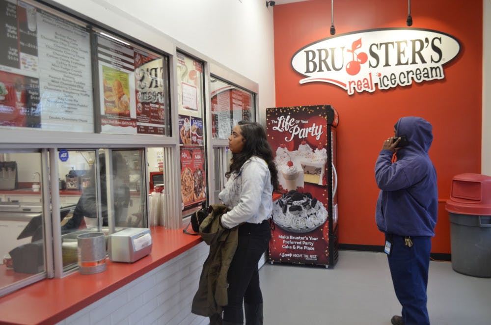 <p>Customers Jenna and Bill Perkins wait in line to buy some ice cream. Jenna and Bill said they have been fans of Bruster's ever since its first location in Memphis opened.</p>