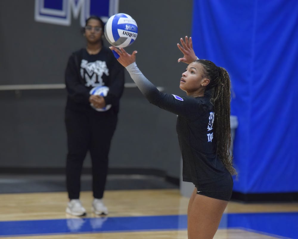 <p>Memphis&#x27; Sydney Marshall prepares to serve in the Tigers&#x27; ﻿3-1 defeat against FAU at Elma Roane Fieldhouse Friday night.</p>