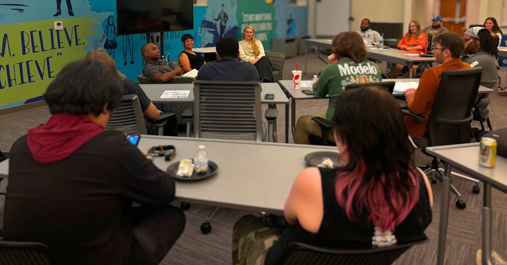 <p>Panelists Lulu Abdun, Jeff Cohran and Morgan Massey speak with students about postgraduate life during Blue Tom Records’ Blue Tomber event at the Crews Center for Entrepreneurship on Oct. 8.</p>