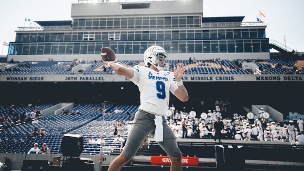 Seth Henigan warms up before the Tigers game against Navy.