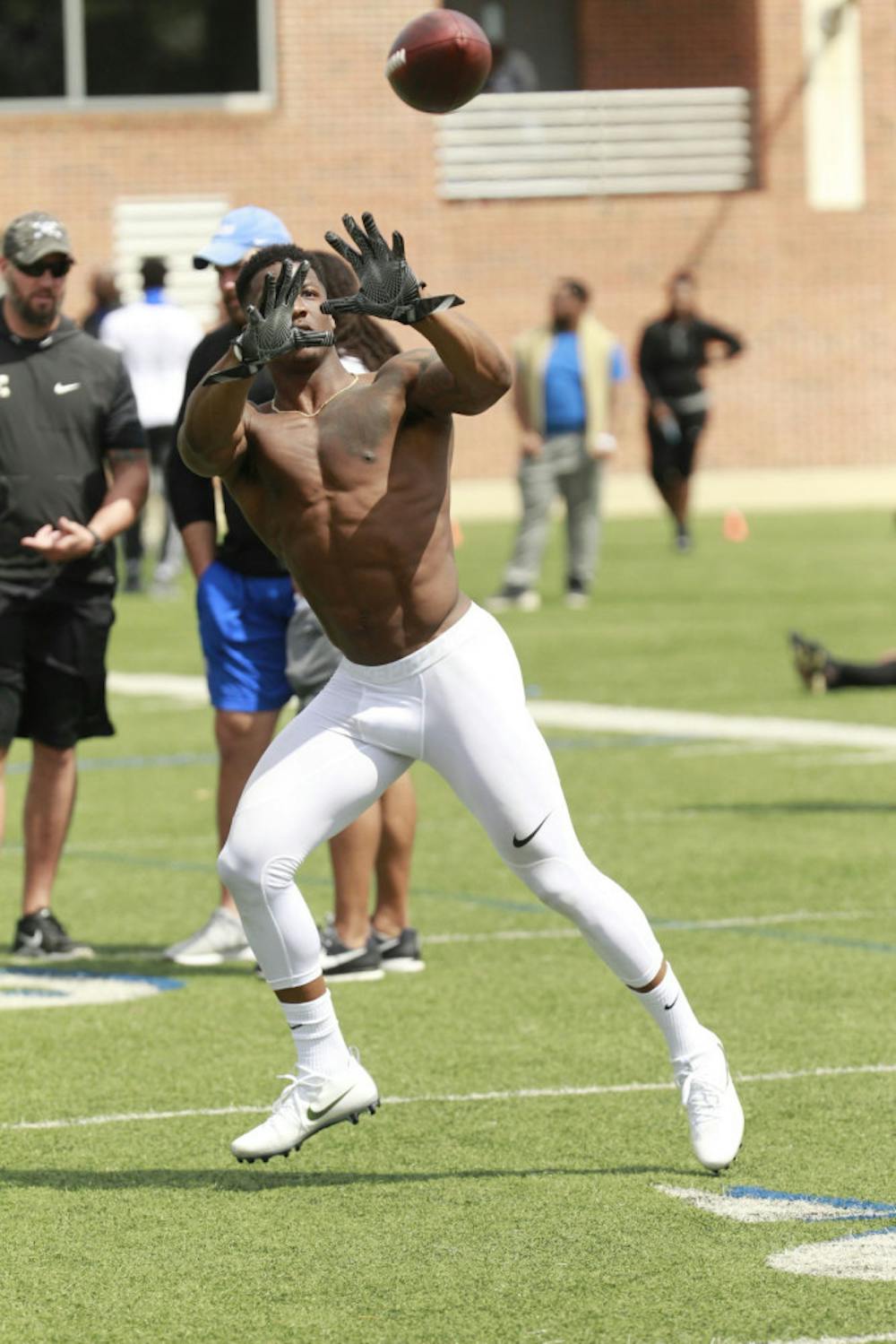 <p>Wide receiver Anthony Miller prepares to catch a pass during drills. Miller, quarterback Riley Ferguson and linebacker Genard Avery were the main players scouts came to see.</p>