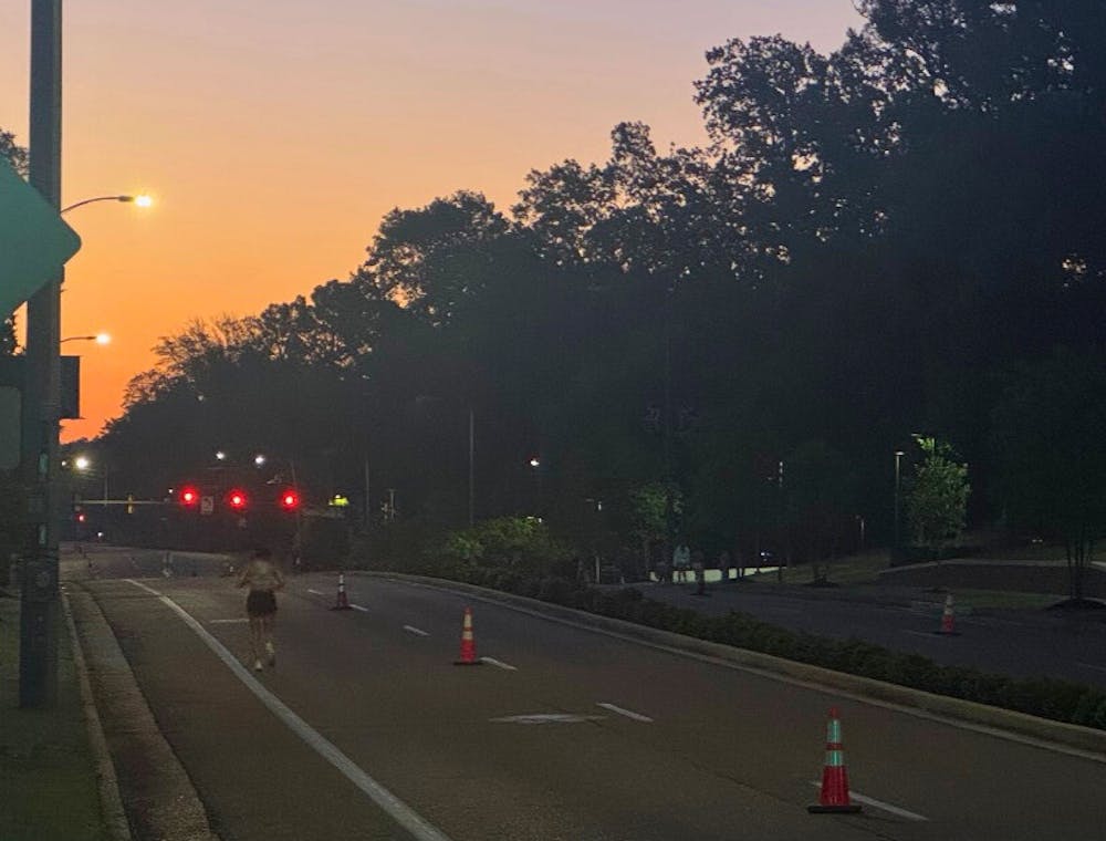 <p>The sun rises over the University of Memphis as a runner runs the route that Eliza Fletcher used to run.﻿</p>