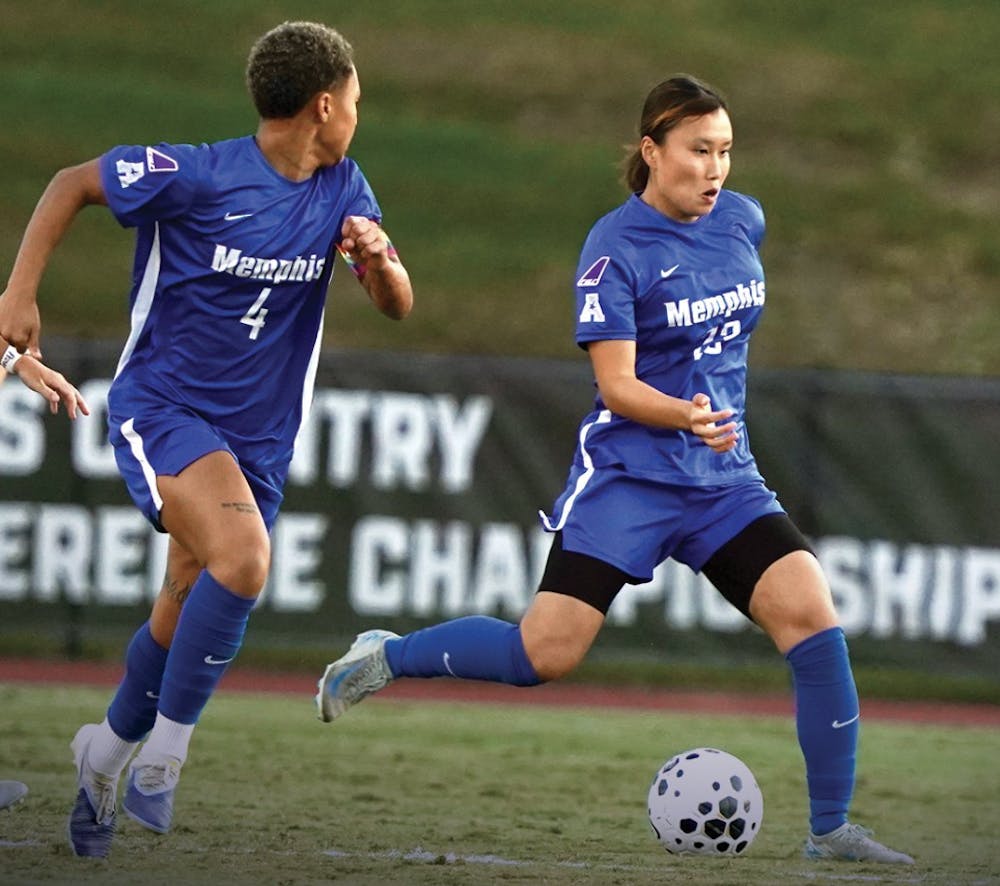 Ai Kitagawa and Ashley Henderson push the ball up the field in the Memphis Tigers' 5-0 victory at ECU Sunday.