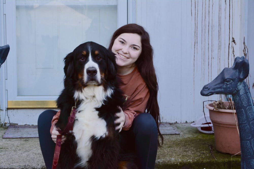 <p class="p1">University of Memphis student Amy Halper, at home in Illinois during Spring Break with her family dog, Boone, hopes to soon be able to afford a service dog to help her cope with epileptic seizures.</p>