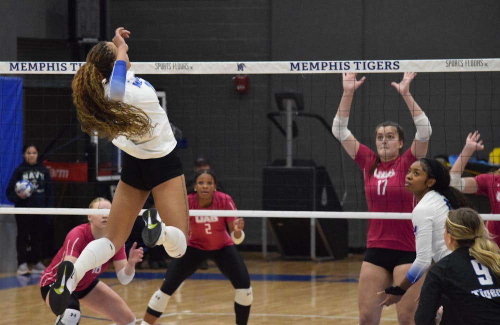 <p>Memphis freshman Zaniah Hoskins, who led the team in kills and points, spikes the ball over the net in the Tigers&#x27; loss to UAB at Elma Roane Fieldhouse Wednesday night.</p>