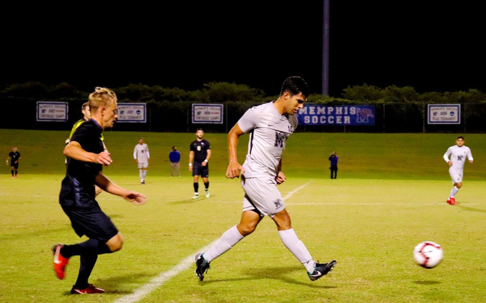 <p>David Zalzman passes the ball to initiate an attack against UCF. Zalzman captained the Tigers in his senior season.&nbsp;</p>