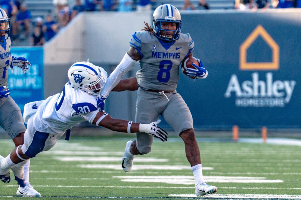 <p>Darrell Henderson rushes pass a defender. Henderson had two consecutive games when he rushed for more 200 yards.&nbsp;</p>