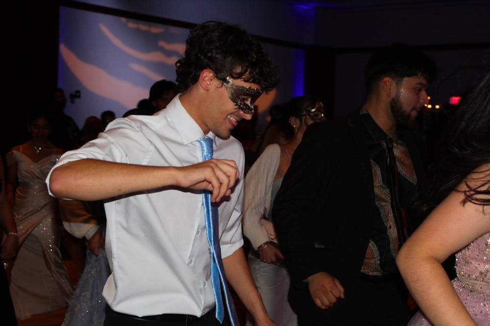 <p>University of Memphis student Dylan Whiteaker shows off his dance moves during the Sapphire Masquerade Ball on Nov. 6.</p>