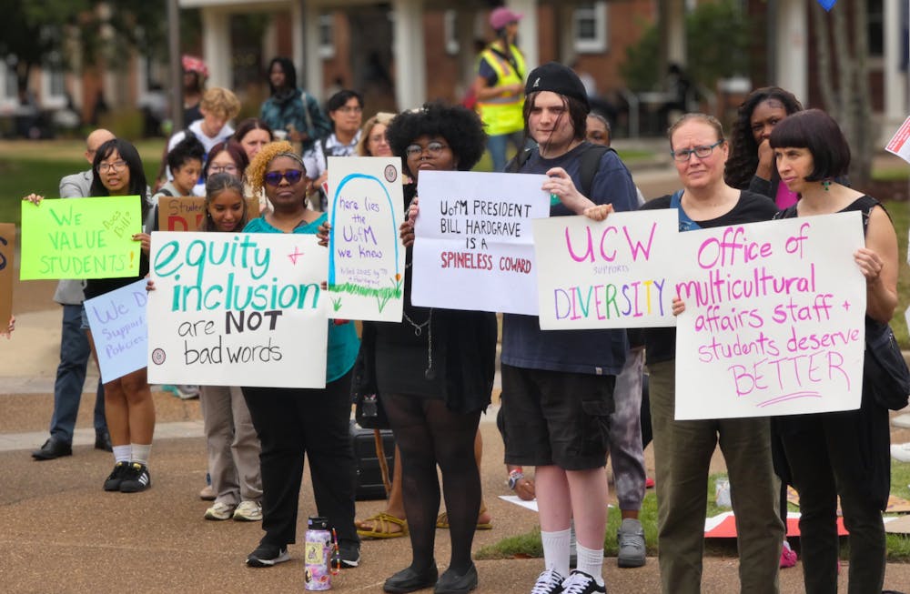 <p>Students and faculty hold signs at the UC Fountain on Thursday, protesting the University of Memphis’ decision to close the Office of Multicultural Affairs.</p>