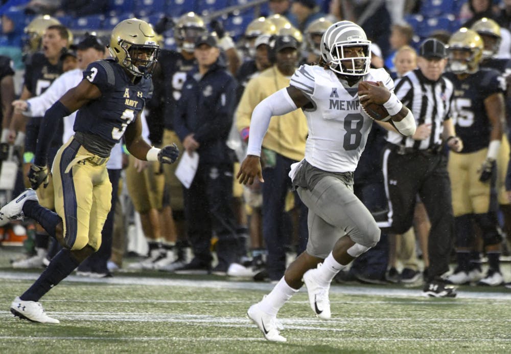 <p>Darrell Henderson rushes past a defender to score a touchdown. Henderson finished the night against Navy with three touchdowns.</p>