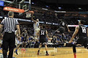 Kyvon Davenport is the person making the basket