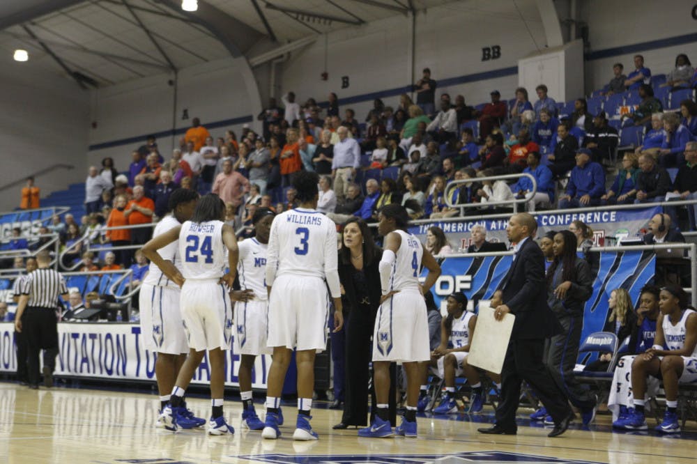 <p>The University of Memphis women's basketball team huddles during a timeout in its game against UT Martin.</p>
