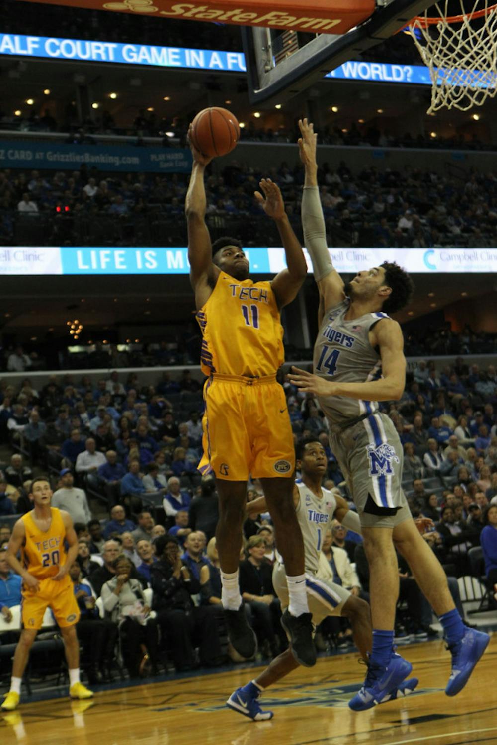 <p>Forward Isaiah Maurice contests a shot at the rim from a Tennessee Tech player. The Tigers won their first matchup of the Penny Hardaway era on Tuesday.</p>