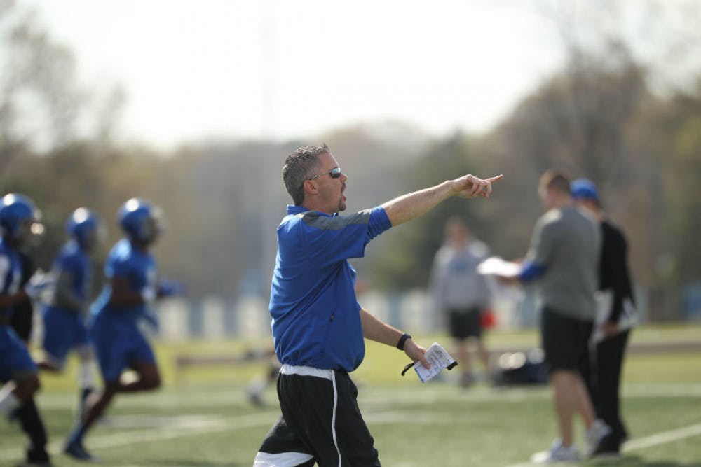 <p>University of Memphis football coach Mike Norvell giving instructions during spring practice. Norvell took over the departing Justin Fuente last December.&nbsp;</p>