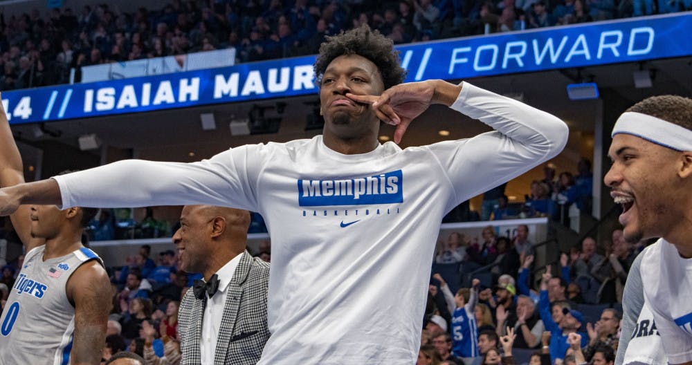 <p>James Wiseman celebrates from the bench.</p>