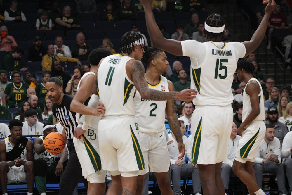 The Baylor Bears huddle together in the first half of their game against Colgate.