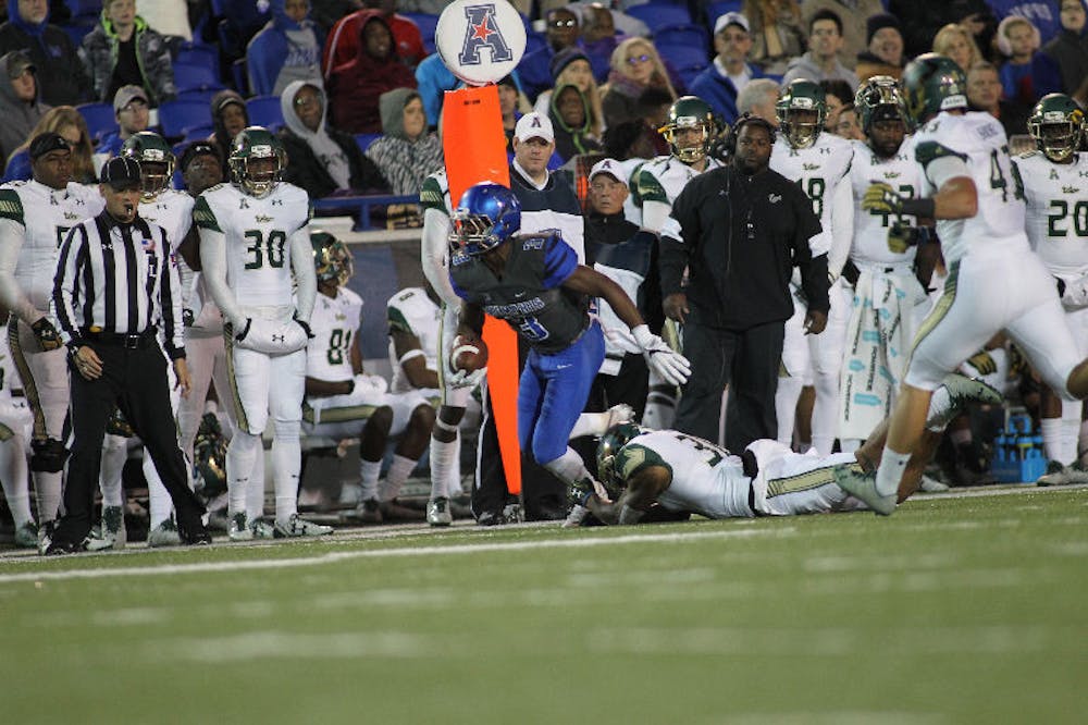 <p>Anthony Miller (3) slips a tackle against USF on Saturday. Miller broke Super Bowl champion Isaac Bruce’s single-season receiving record of 1,054 yards against the Bulls. After his 10-catch, 153-yard performance on Saturday, Miller now has 1,077 yards through 10 games, and he only needs eight catches over the next three games (which includes a bowl game) to break Bruce’s single-season receptions record of 74.</p>