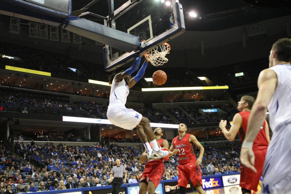 <p>Shaq Goodwin dunks the ball in an exhibition game against Christian Brothers University in the 2014-15 season. Goodwin finished top 15 in program history in scoring and top 10 in rebounding.&nbsp;</p>