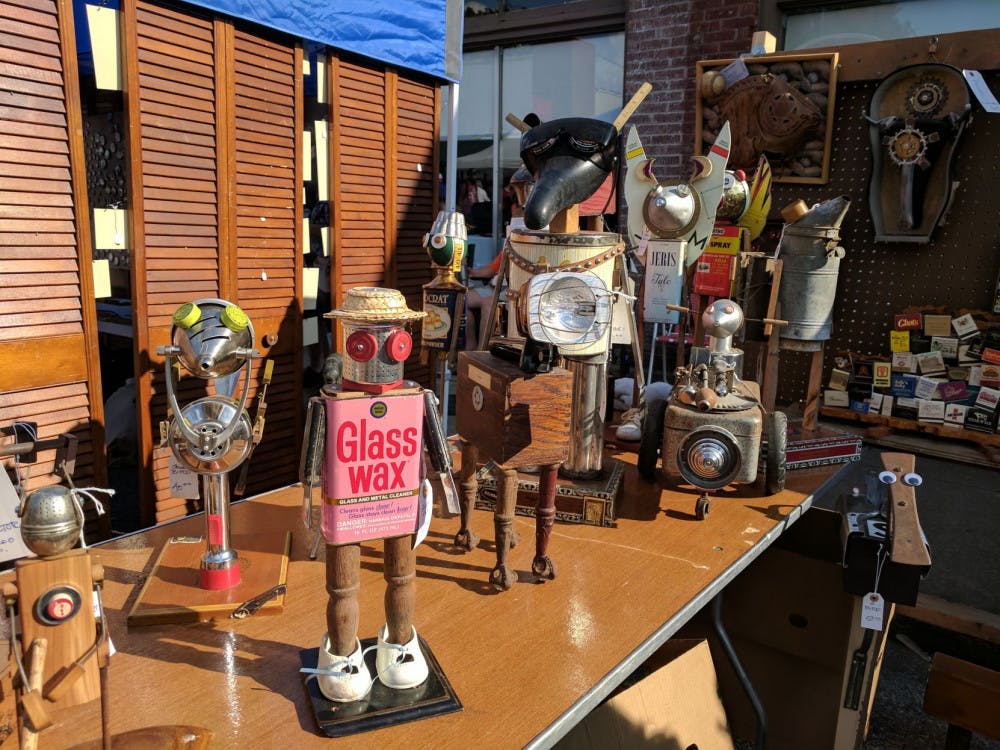 <p>Art by Kenny Hays is displayed at the 2017 Cooper Young Festival. Saturday marked the 30th year of the festival as many Memphians crowded Cooper Street to observe and purchase artistic works.</p>