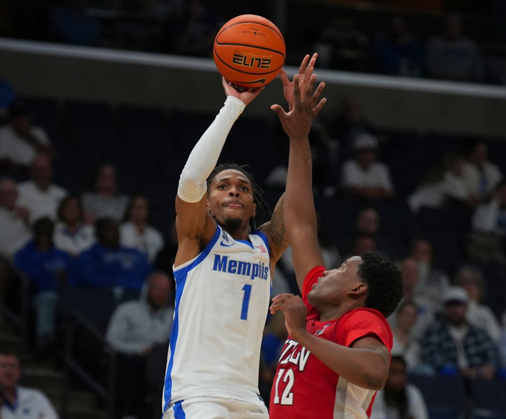 <p>Memphis guard Dug McDaniel shoots a contested three over a UNLV defender in the Tigers&#x27; 92-78 loss to the Runnin&#x27; Rebels Sunday afternoon at FedExForum.﻿﻿</p>