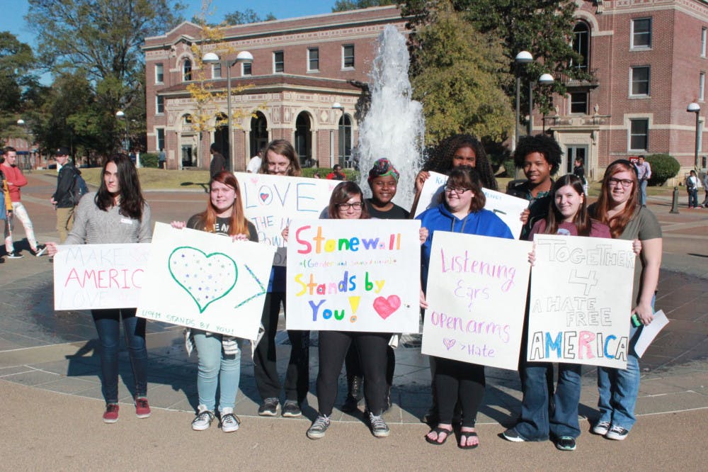 <p>Students of the Writing Department and Tiger Life come together to send a message of unity and love in front of the UC Fountain Thursday afternoon.</p>
