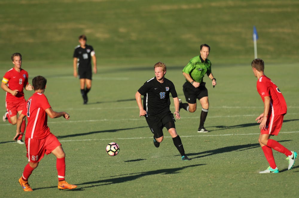 <p>Jackson Morse dribbles the ball while looking for open teammates. Morse earned the honor of being selected to the AAC All-Rookie team last season.</p>